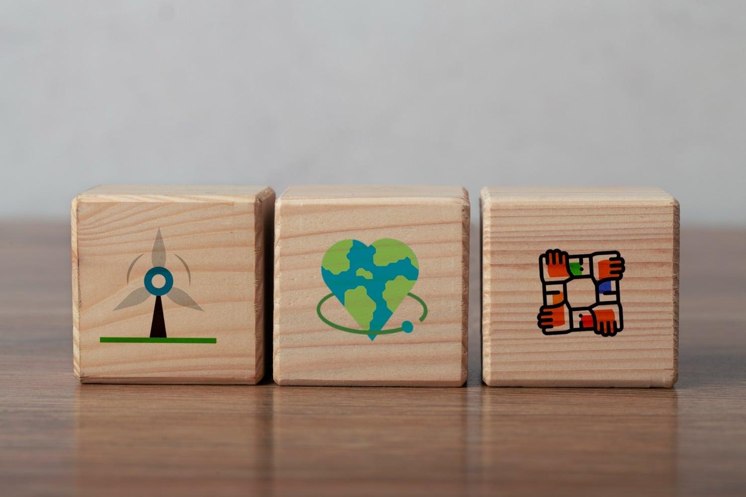 Employee Wellbeing and the ESG Social Pillar: What Every Company Needs to Know Objects representing the ESG framework and sustainable development goals in a business environment - Zen2Fit Corporate Wellness