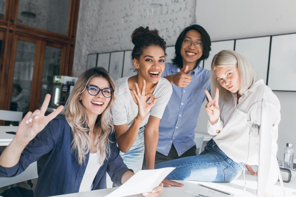 Employee Wellbeing and the ESG Social Pillar: What Every Company Needs to Know A united and satisfied team as a result of employee wellbeing care - Zen2Fit corporate wellness
